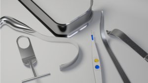 A set of surgical instruments, including retractures and a bovie.